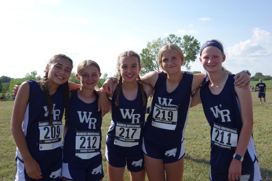 At the Cross Country Meet in Wamego, on Tuesday, Sept. 6th, 8th graders Maile Eldrigde, Emery Hall, Kate Muir, Kolbi Trower, Kinsley Freeman, pose for a picture after they finish the race.