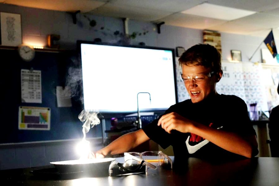 8th grade SWAT student Brecken Garrett lights a fire in Mrs. Caseys science class on Sept. 2nd.