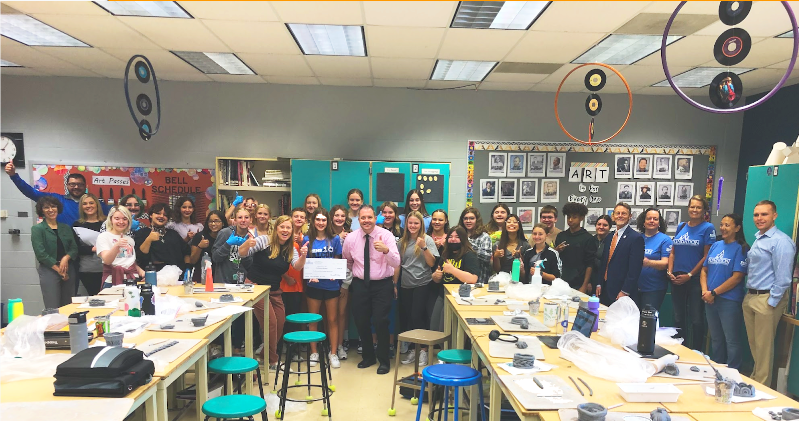 WRMS art teacher Mindy Armstrong accepts a grant for her childrens book project by posing with the award committee and her 2nd hour class. This award will impact 65 students in the art department. Armstrong said, Students will be a part of a collaborative childrens book that they will write and create visuals. 
Story by Jolie Workman, Kinsley Freeman & Maddi Bahr