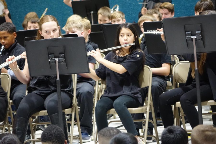 7th graders Jacqueline Tichenor and Layne Streeter, play their flutes at Indian Hills for the elementary students on Thursday, November 10th.