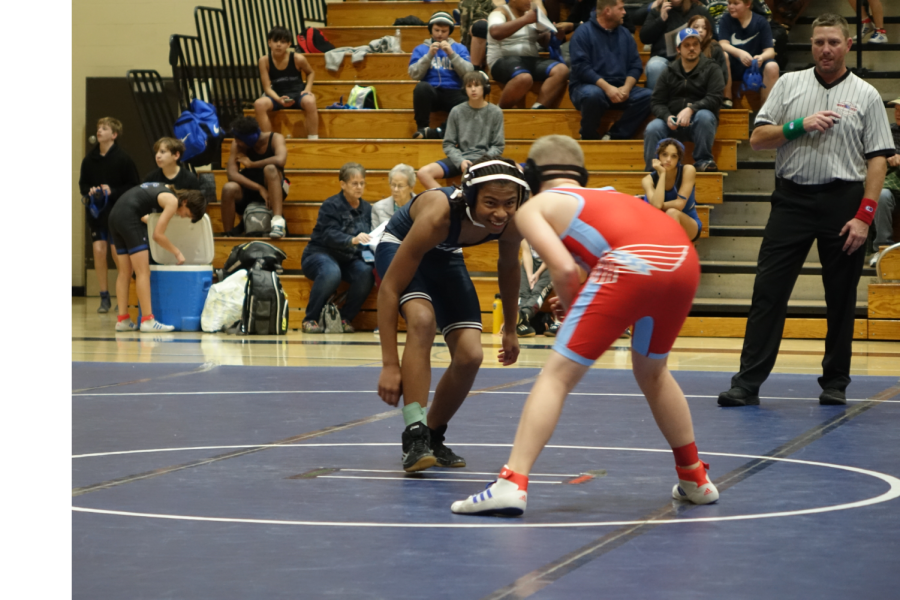 8th grader Marcellus Robinson-Adams, stares down his opponent on 11/14/22.