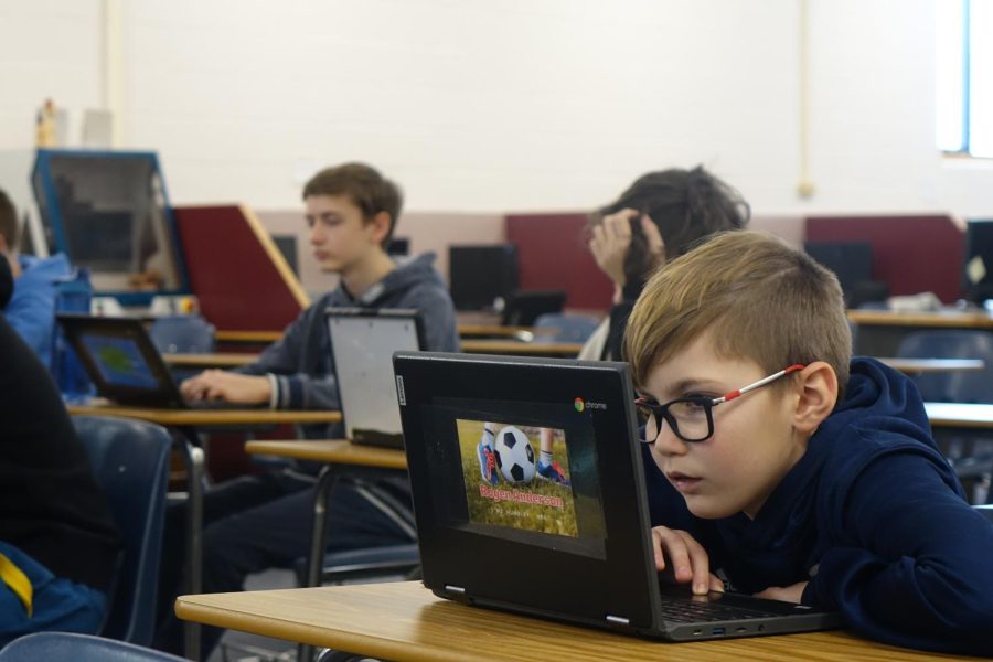 On January 25th, 8th grader Rogen Anderson concentrates while working on his computer to code his Co2 car in Tech class. Story by Caliyah Moore.
