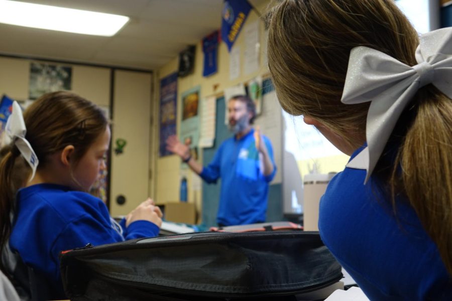 7th graders Maggie Randall & Alayna Bivens listen to All Star Social Studies teacher Mr. Heinritz teach during 2nd hour about Bleeding Kansas and how Preston Brooks beat Charles Sumner with a cane 34 times because Charles Sumner insulted Brooks’s uncle. Story by Jacob Eilert.
