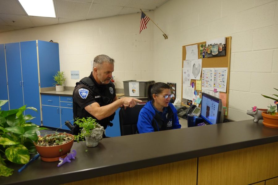 Officer McCarter and Ms. Rachel work together in the security office on January 26th to look through camera footage for something that happened at lunch. Story by Audrey Gathers.