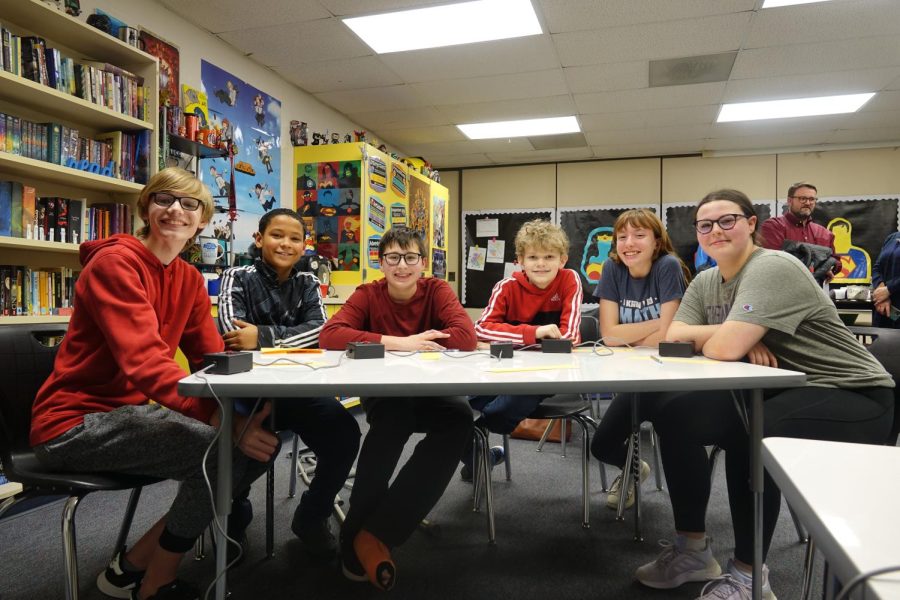 The 7th-grade Scholars’ Bowl team takes a break in between rounds of their meet on January 25th to  take a quick photo. The team took second place at the  meet. Pictured here from left to right are Charlie Stones, Paxton Poe, Thomas Appuhn, Archer Sonteregger, Emma Smith, and Aubrey Taylor. 
