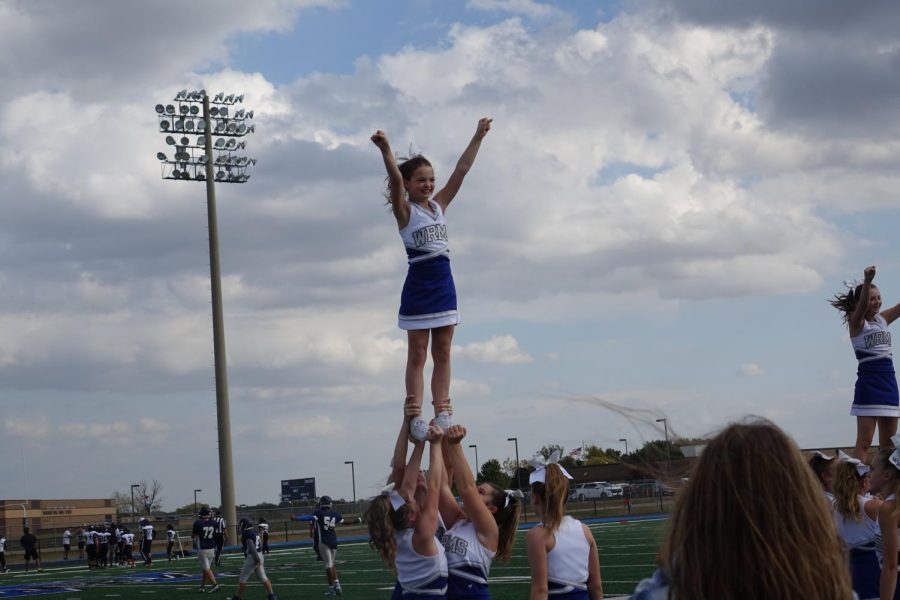 Alayna Bivens and her stunt group do an extension on October 11th at the 7th grade football game. 
