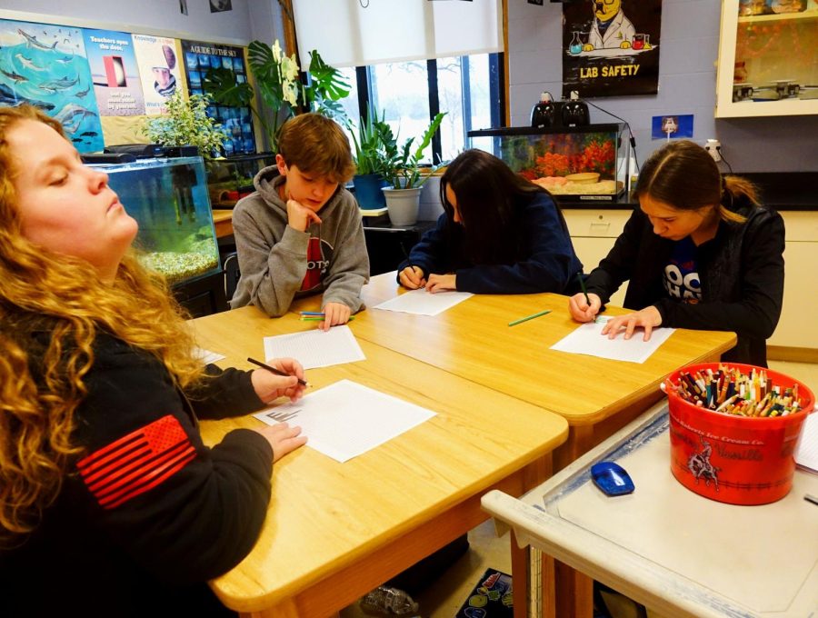 On March 9th, Logan Herrman, Clyne Foust, Ellie Streeter, & Katelyn Carlson color during their Voyager team day celebration for the end of the 3rd quarter. Caption by Mady Nelson.
