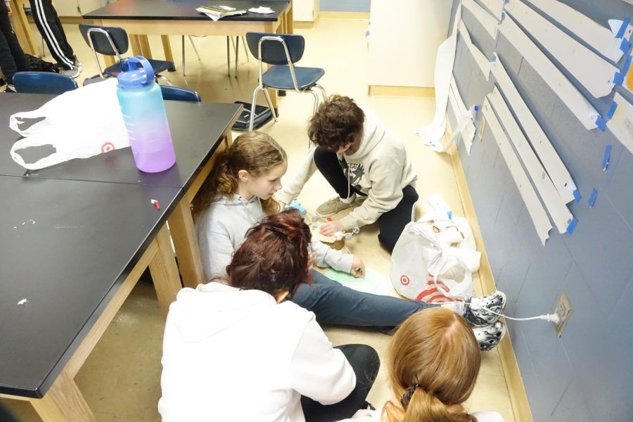 On January 27th, 8th grade students, Anah St. John, Auggie Elliot, Katherine Mcpherson, & Ava Mace, build their rover in science for the rover project. The project included seeing if the rover would roll and then filling it with a water balloon and dropping it off the roof.