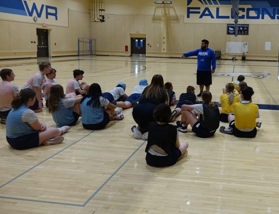 PE student teacher, Coach Reed, talks to the 3rd hour PE class about what activity they are doing on May 3rd at WRMS in Gym A. Coach Reed loves what he does. Reed said his favorite part is “being able to interact with students and having fun doing the games.” 