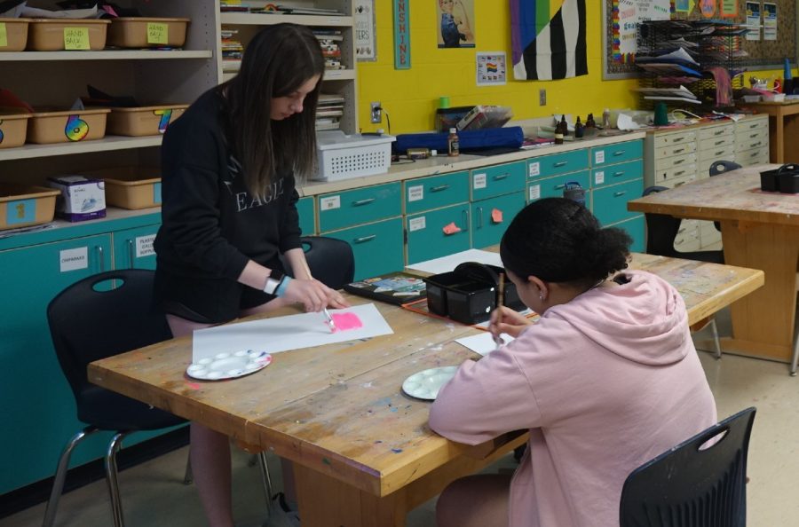 On Wednesday, May 3rd the 8th grade art room works on their group projects that are due on May 6th. 8th grader Samiya McGlory works on her art painting project and said she really likes art because, “I like all of my friends here and the teachers.”