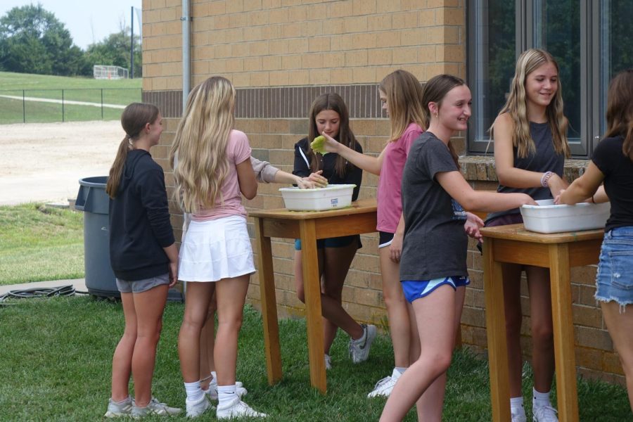 On August 26th 2022, 8th grade science classes come together outside to make slime in small groups.
