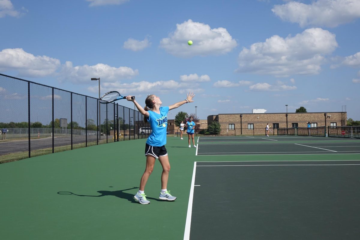 On Tuesday, September 12th, 8th grader Bella Nikkel served the ball to her opponent on  Seaman Middle school at the WRHS tennis courts.