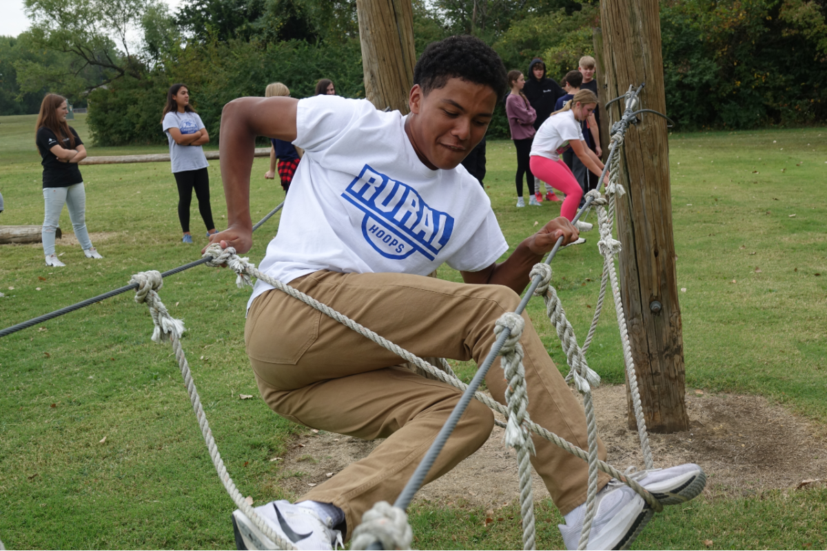  Myles Bradley climbs the ropes during 5th hour in SFA. the wave team was outside in all hours to do then challenge course. The course is a challenge for students to complete and work together. The challenge course is located at the backside of WRMS
