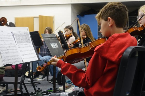 Viola player. Brody Branch prepares for an upcoming concert with his classmates during 7th hour. October 17th. 
