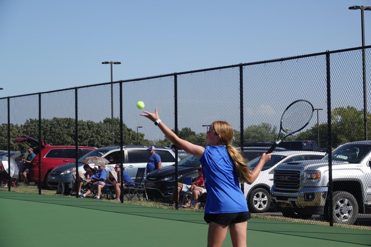 Ava Fritz serves the tennis ball on September 8th at the girls tennis meet. 
