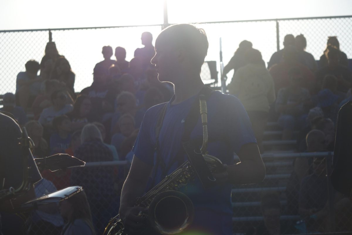 8th grader Zachary Hancock plays the Saxophone at the high school pre-game to kick off the football game on September 8th.