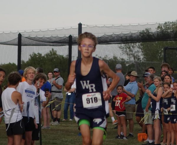 Henry Laubach finishes the race at the WRMS Home Meet. 