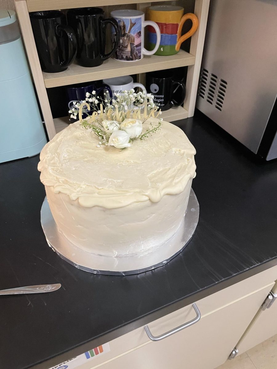 The cake, made by yearbook student Alayna Bivens’ mom, helps students celebrate the wedding on October 12th in the pressroom. When asked about the cake Bivens got an early viewing of the cake, “Yeah just the outside not the inside.”