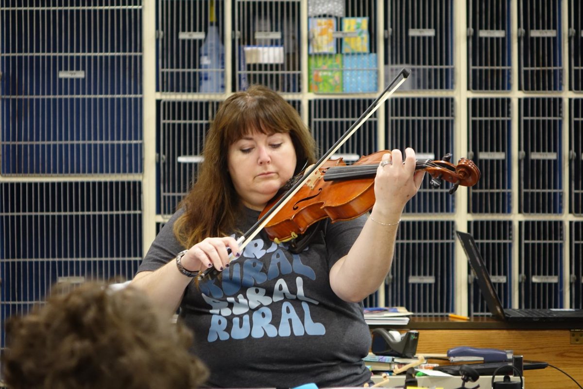 Mrs. McLeland plays viola with the Orchestra during first hour on November 16th.