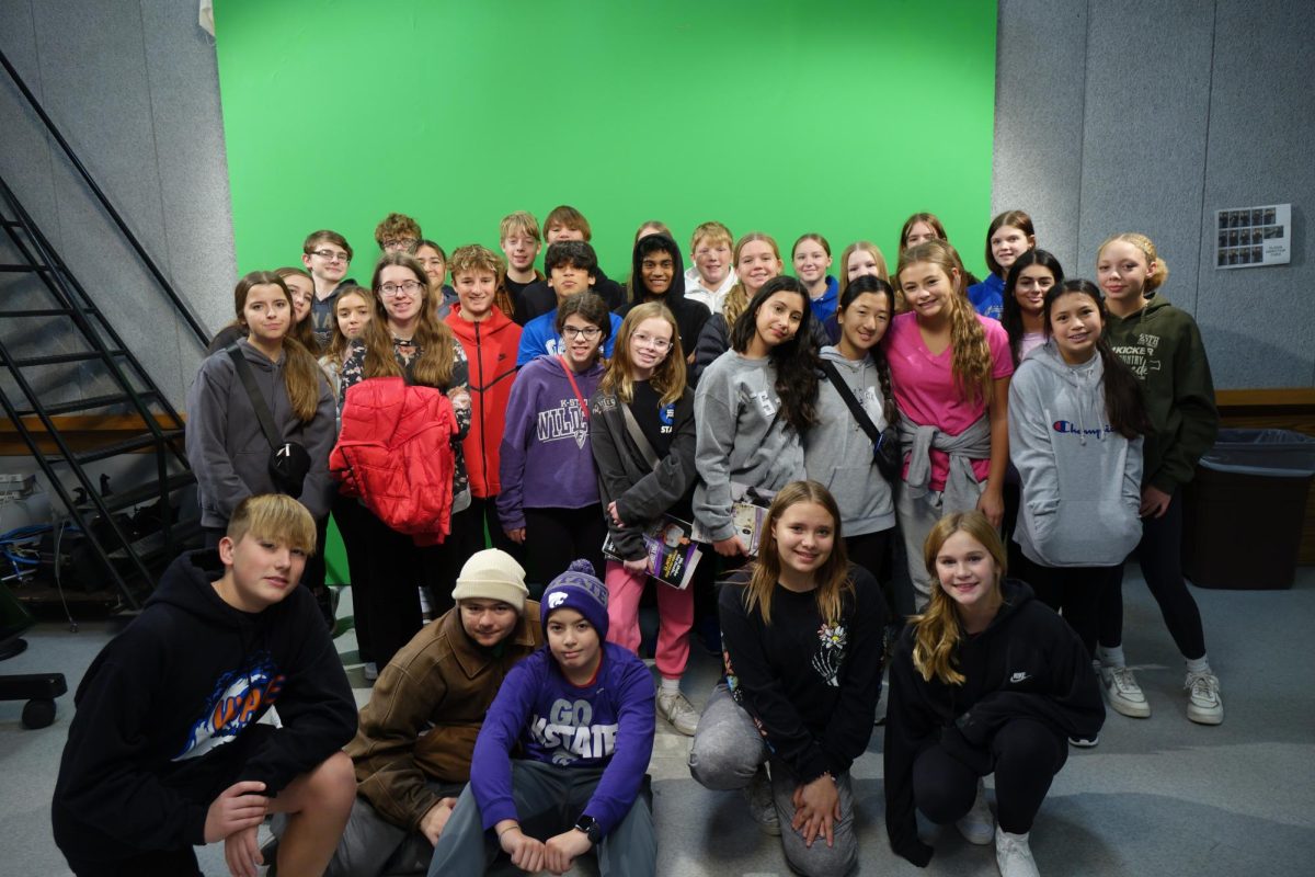 Washburn Rural Falcon Press poses for a picture in front of the green screen on November 1st while in the Kansas State University broadcasting room. 
