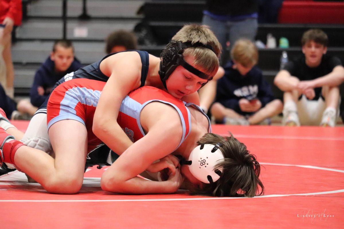 7th grader, Andrew Peterson, at Centennial Middle League (CML) wrestles his opponent on Saturday December 9th. Peterson said “My favorite part of middle school wrestling is probably the tournaments.” 