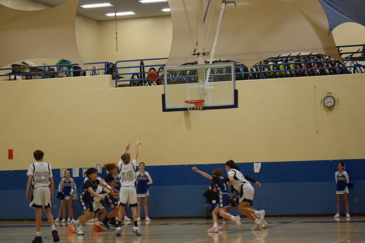 At the 7th grade boys basketball game on Thursday, January 25th. Jet Dodder  shoots a free throw against Lawrence Southwest Jr.  
