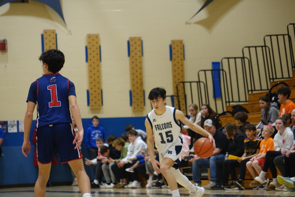 8th grader Everett Un dribbles the basketball in his game against Seaman on January 29th at WRMS.
