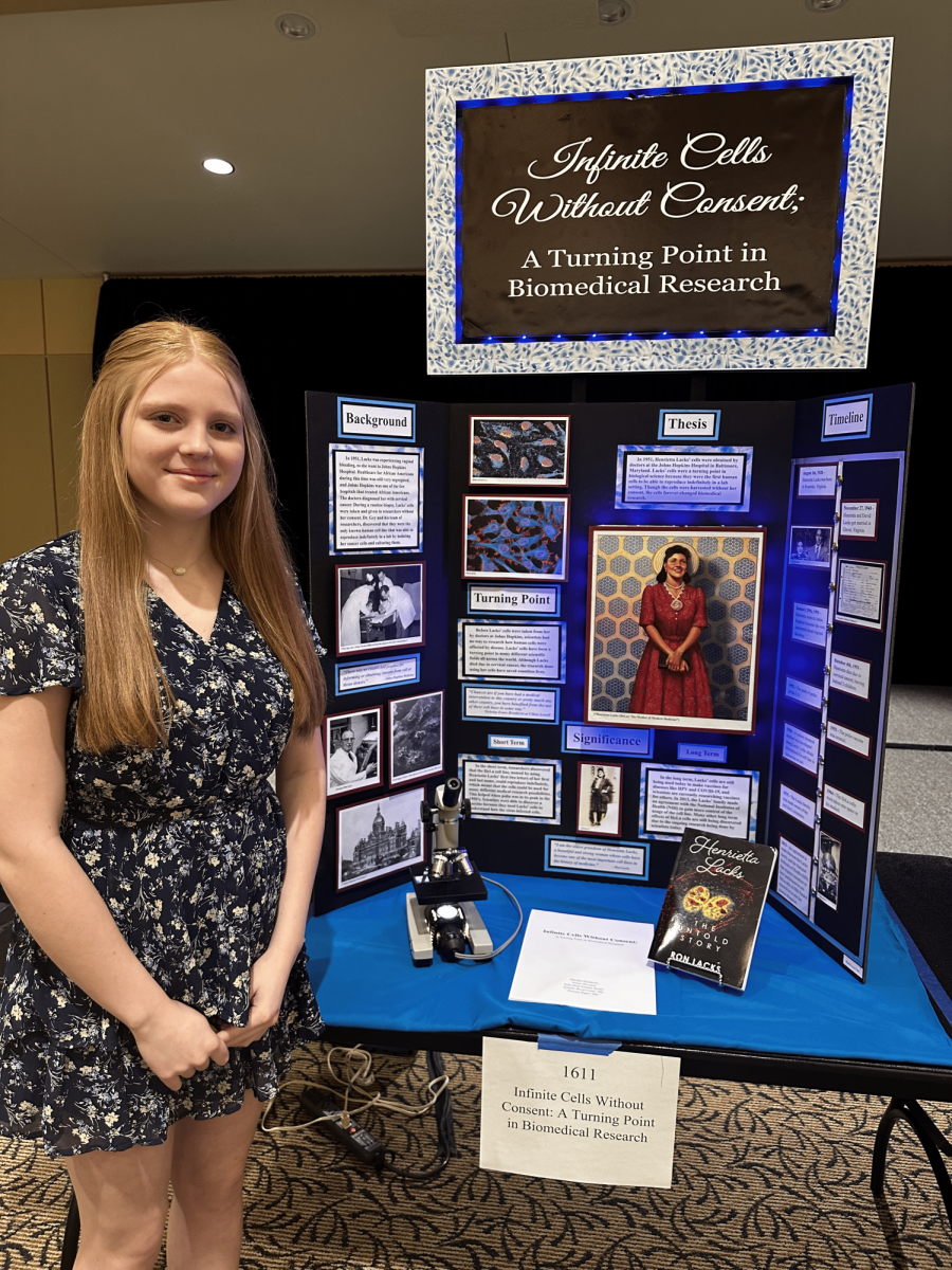With her individual exhibit board, “Infinite Cells Without Consent: A Turning Point in Biomedical Research,” 8th grader Hayden Hedstrom won 1st Place at District History Day.