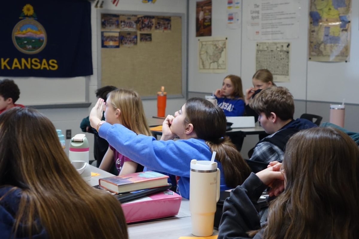 On February 7th, 7th grader Carly Lafond raises her hand to ask a question about Bleeding Kansas in Mr. Mills 3rd hour history class. 