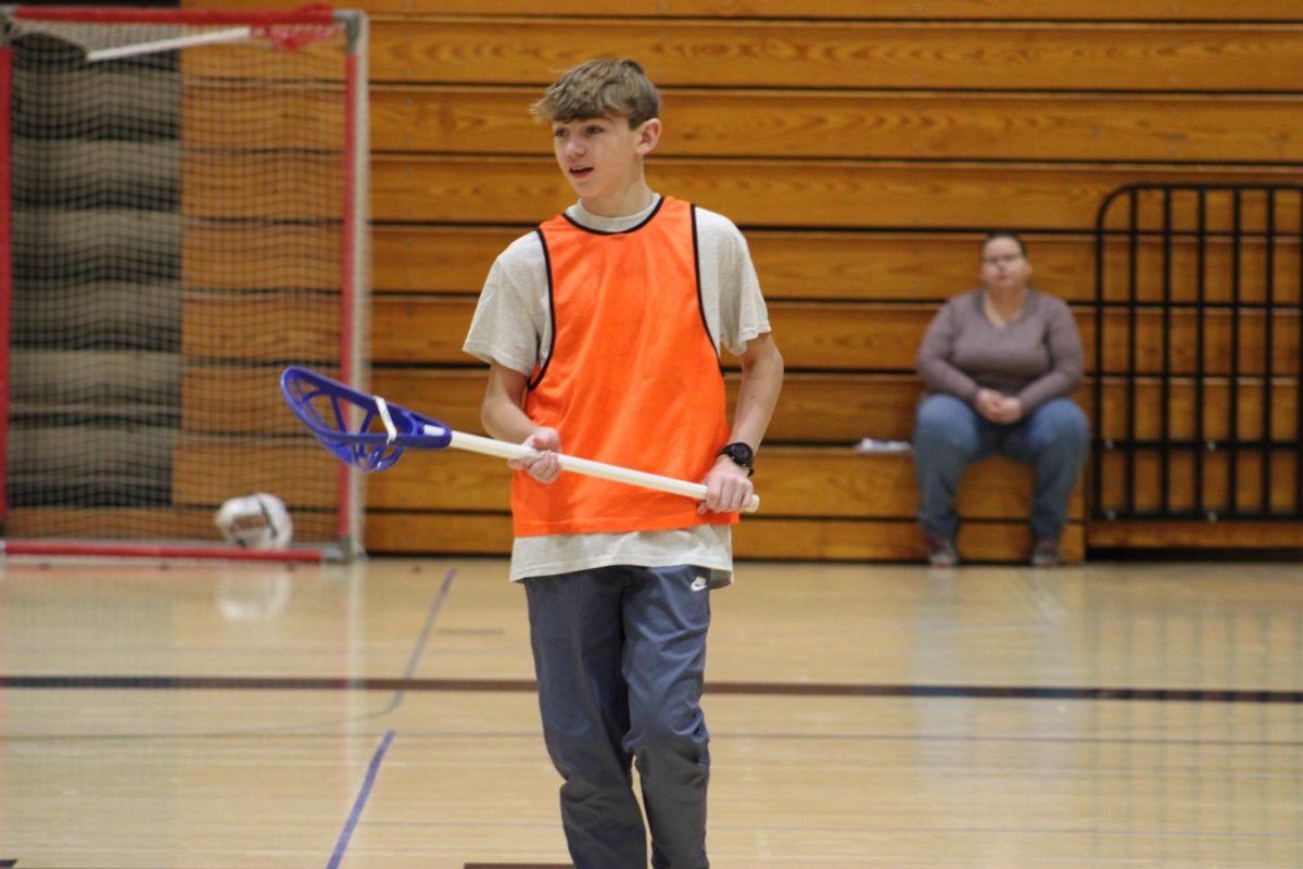 On Jan. 3rd, 3rd hour PE is playing lacrosse while 8th grader Duke Graf walks to the middle of the court in gym A after his team scores a goal.
