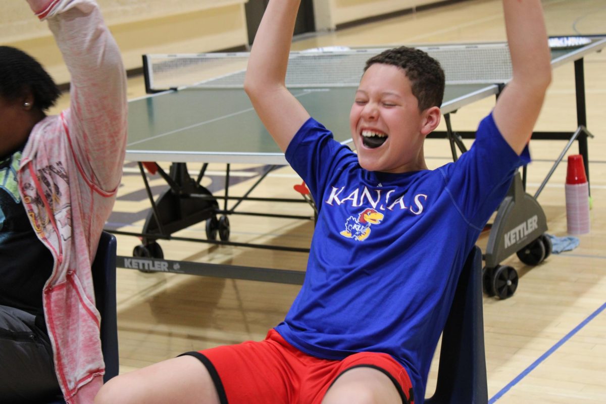  7th grader Alden Tucker celebrates getting the Oreo in his mouth on April 10th, during 7th grade Minute to Win it Game, Face the Cookie. Tucker said, “I would play it again next year because it was fun, and I got to eat food.”