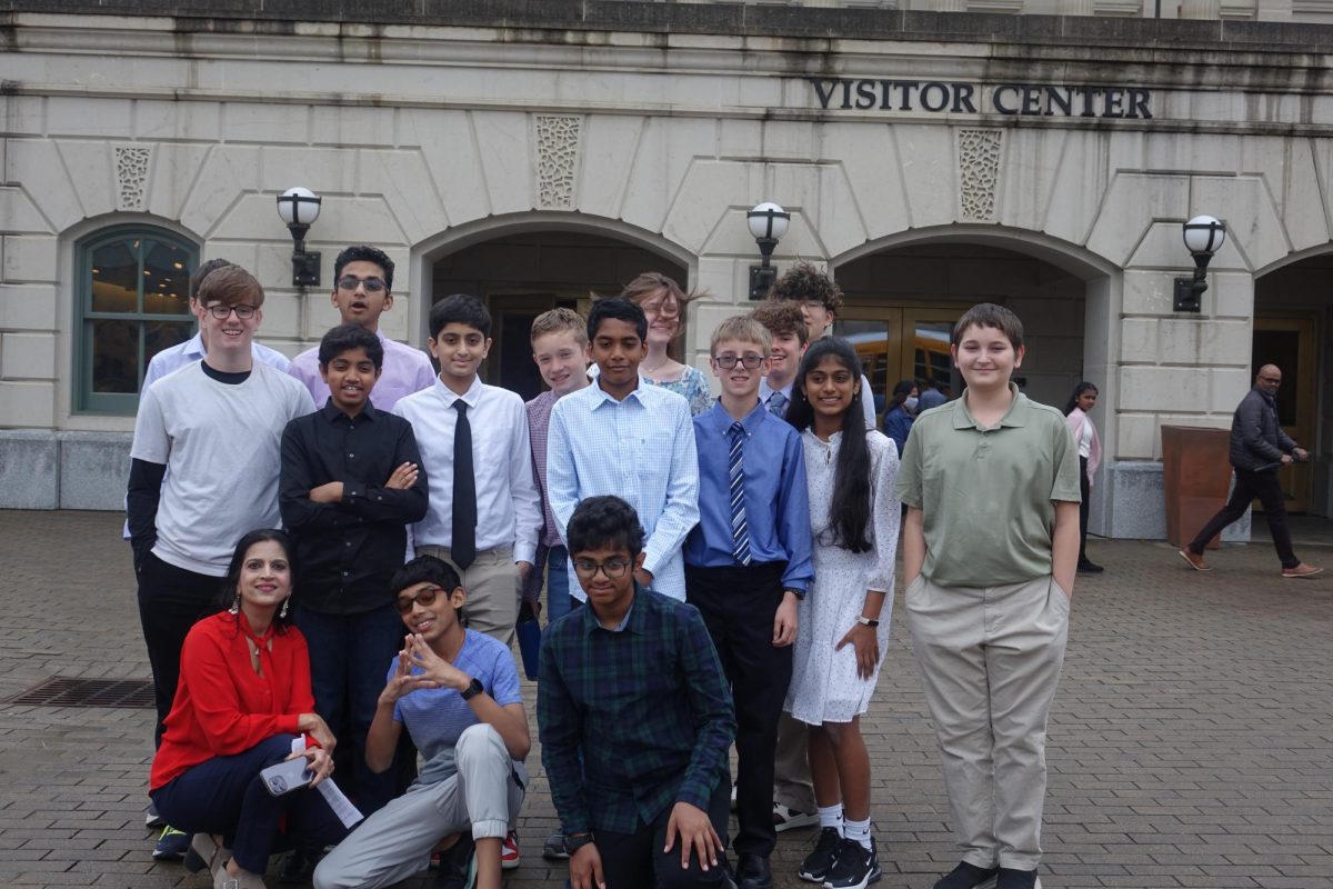 Chess Club members pose for a picture at the state capitol building.