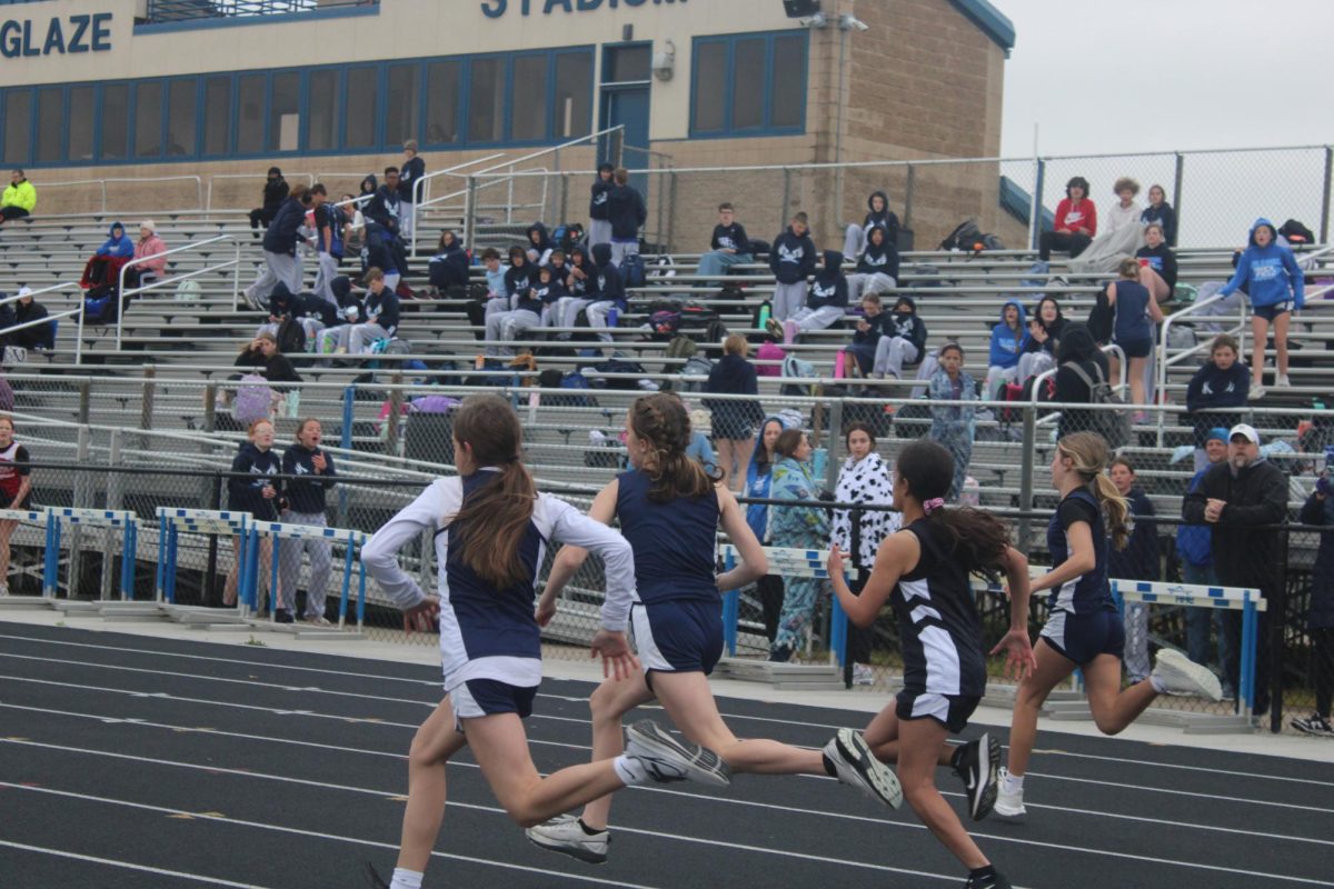 7th grade girls race to the finish on April 2nd at WRMS
