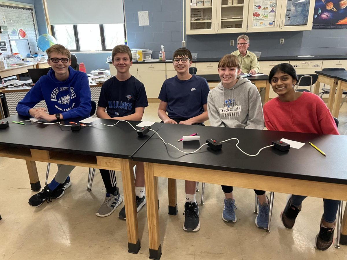 8th grade Scholar's Bowl team members Charlie Stones, Easton Holthaus, Thomas Appuhn, Emma Smith & Manaswini Koduru pause for a photo between rounds at the WRMS tournament on Wednesday, April 10th. The team took 3rd place and competed against Junction City, Seaman, and Emporia, who took 1st.