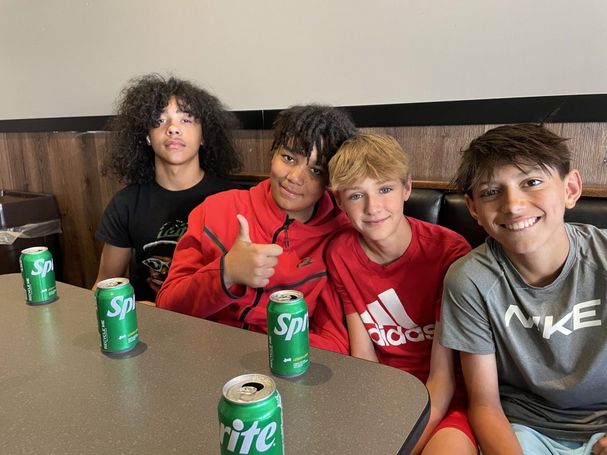 News staffers, Elijah Guyton, Daniel Martin, Henry Laubach, and Maddox Valdivia get their picture taken at lunch after their field trip to the WIBW news station. “My favorite part of the field trip was when we got pizza, because it was good,” said Guyton.