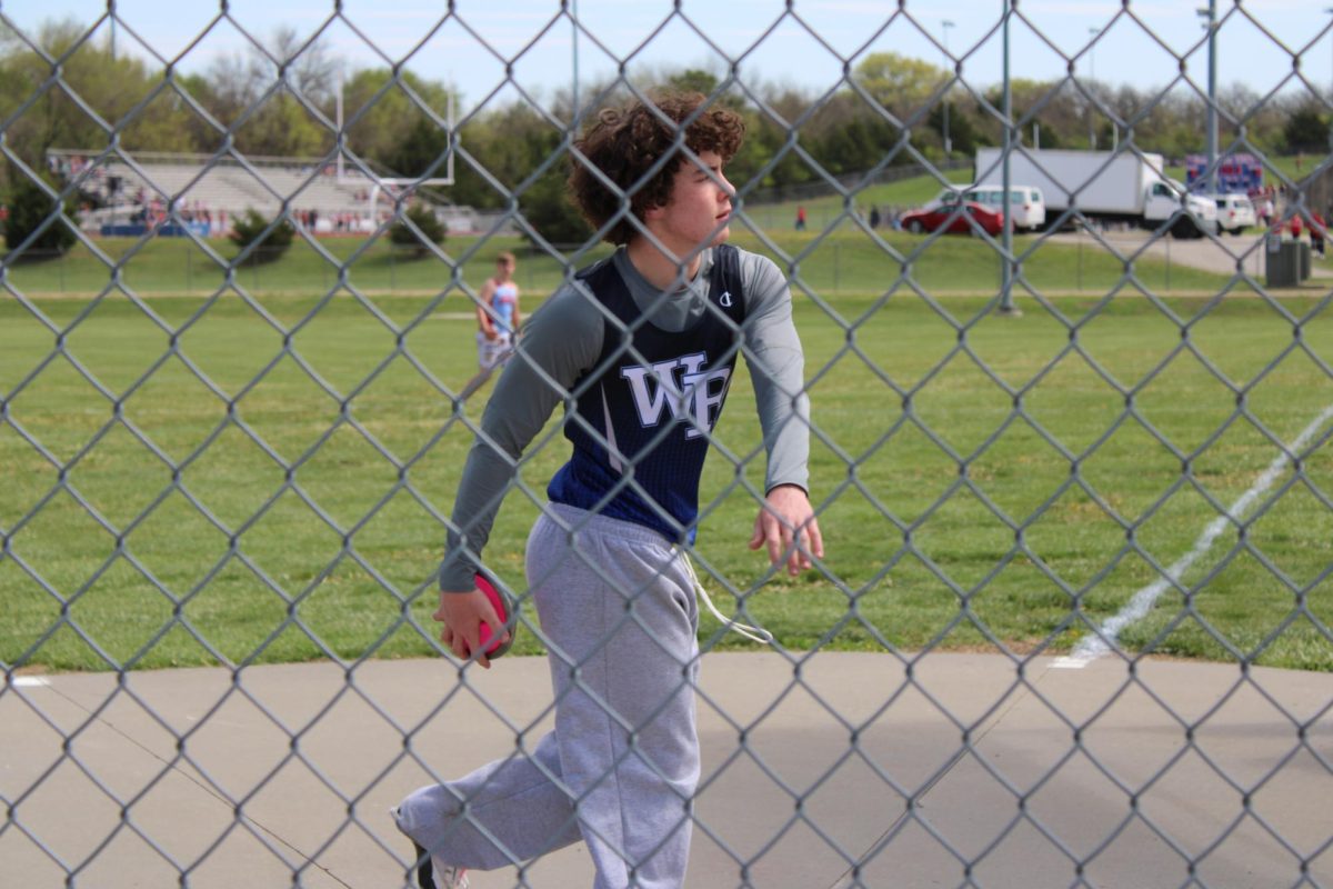 Lucas Penrod, an 8th grade Varsity thrower for track and field is getting ready to throw the discus at Seaman on April 19th. Penrod said, “Hanging out with friends at a track meet was my favorite memory from the track meets.” He prefers throwing this year because running wasn’t for him last year. 
