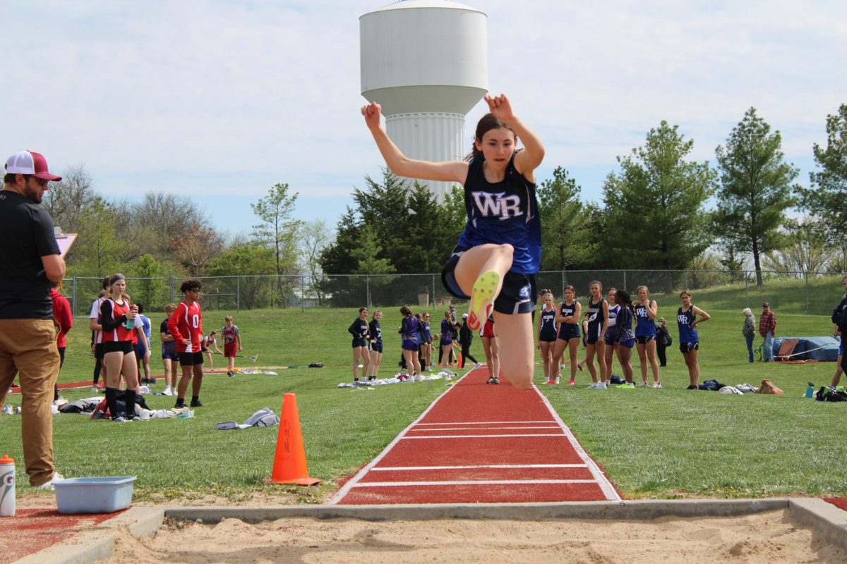 On April 19th, 8th grader Reese Beardslee jumps for the long jump at Seaman. 
