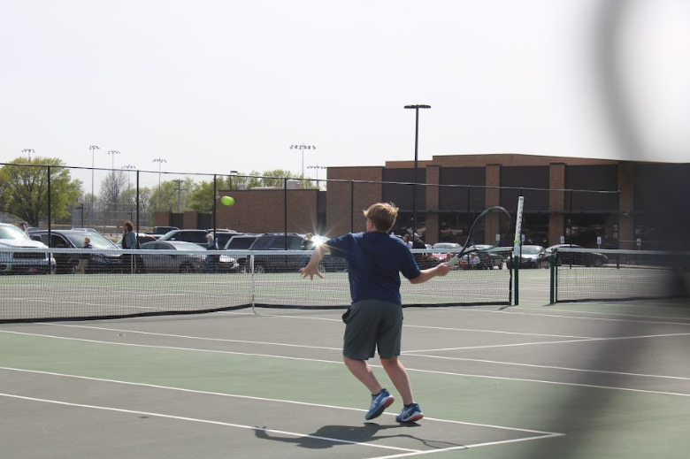 Connor Klausman, 7th grade JV tennis player gets ready to hit the tennis ball back at the quad on April 9th. Connor Klausman said, “Whenever the match starts I think about hitting the opponents weak spot and getting his shots in.” His favorite part in the season so far is playing with his doubles partner, Liam Wiksten. 
