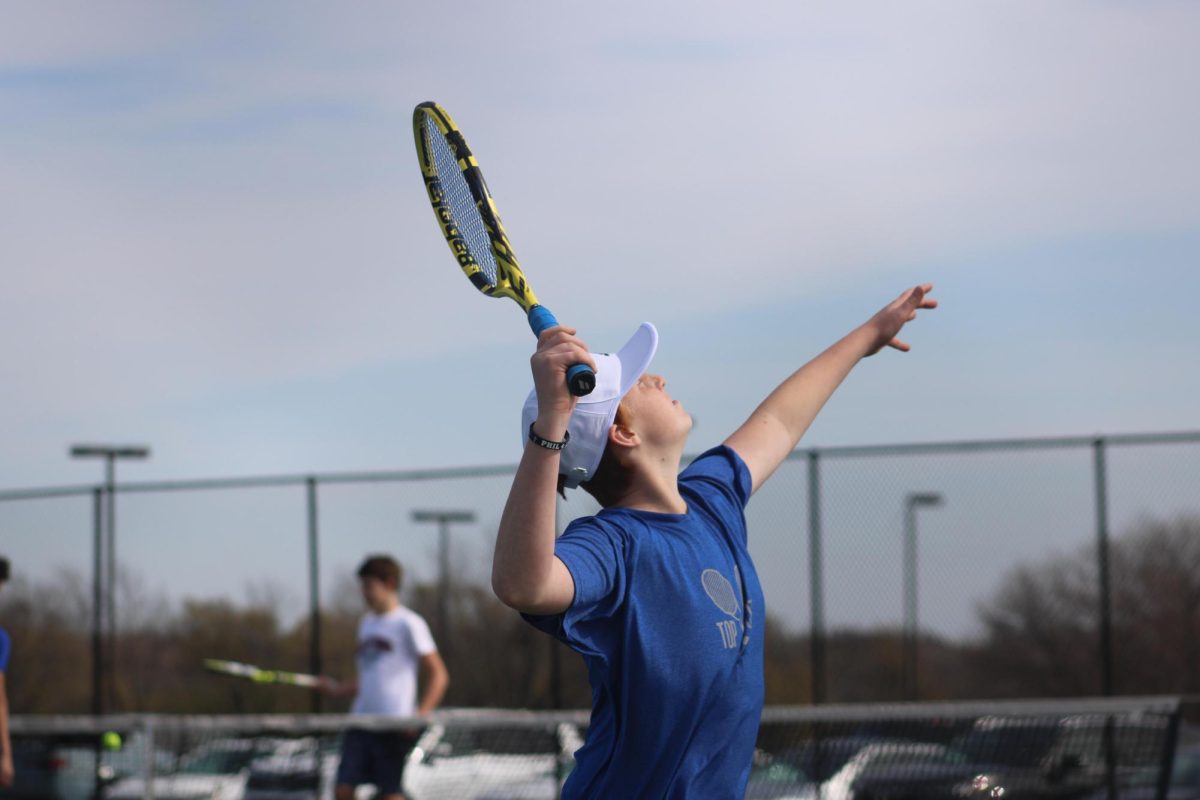 On April 9th, 7th grader Alex Bettis serves at the Quad, at WRMS. 
