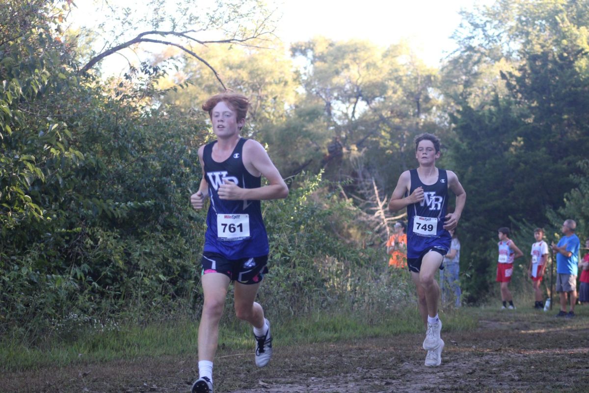  8th graders, Oliver Haberman and Lawson Streeter run to compete for the cross country team at the WRMS home meet on Sept 26 .
