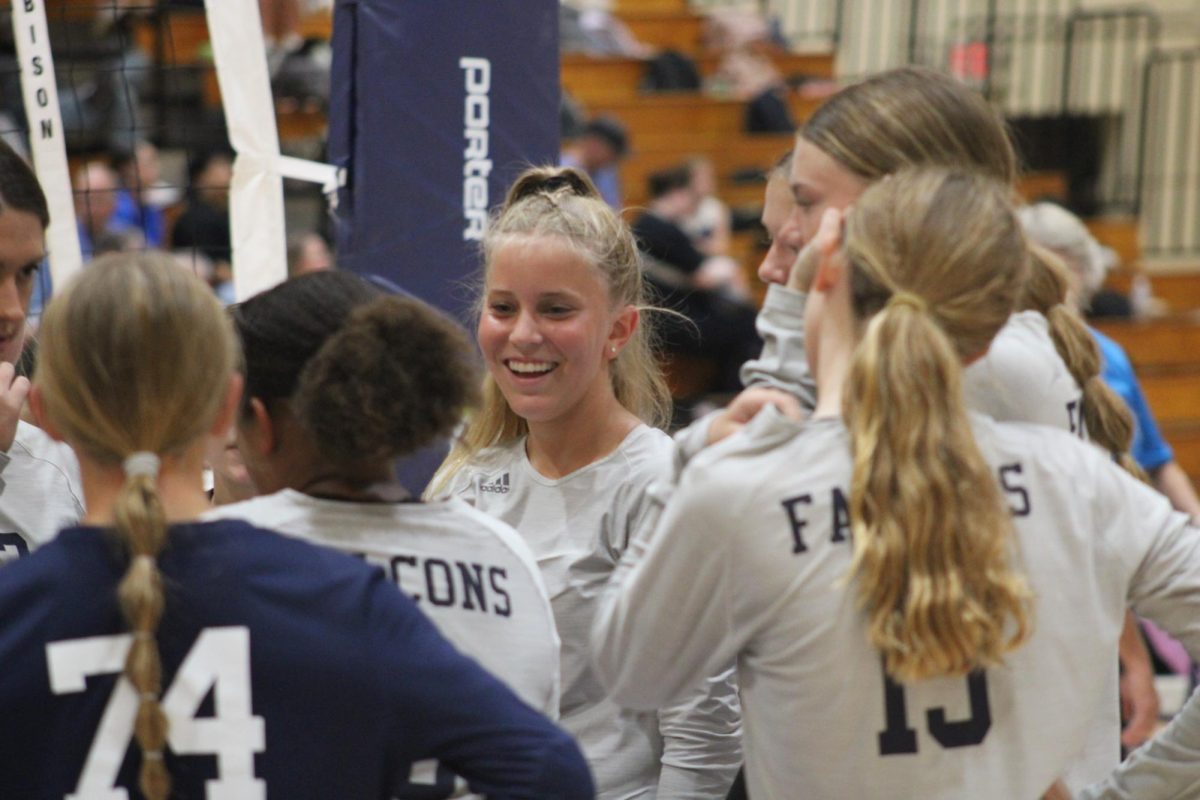 In the WRMS gym on Sept. 17, 7th grader Kinsley Roth smiles during a timeout to celebrate the team's lead against Seaman.