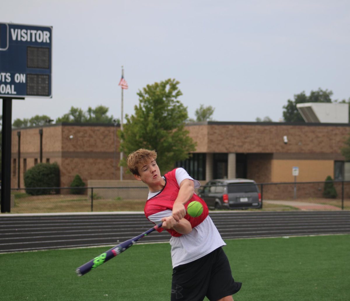 During 3rd hour PE, Eli Domann hits a home run while playing softball on the 7th grade football field on Sept. 18. 
