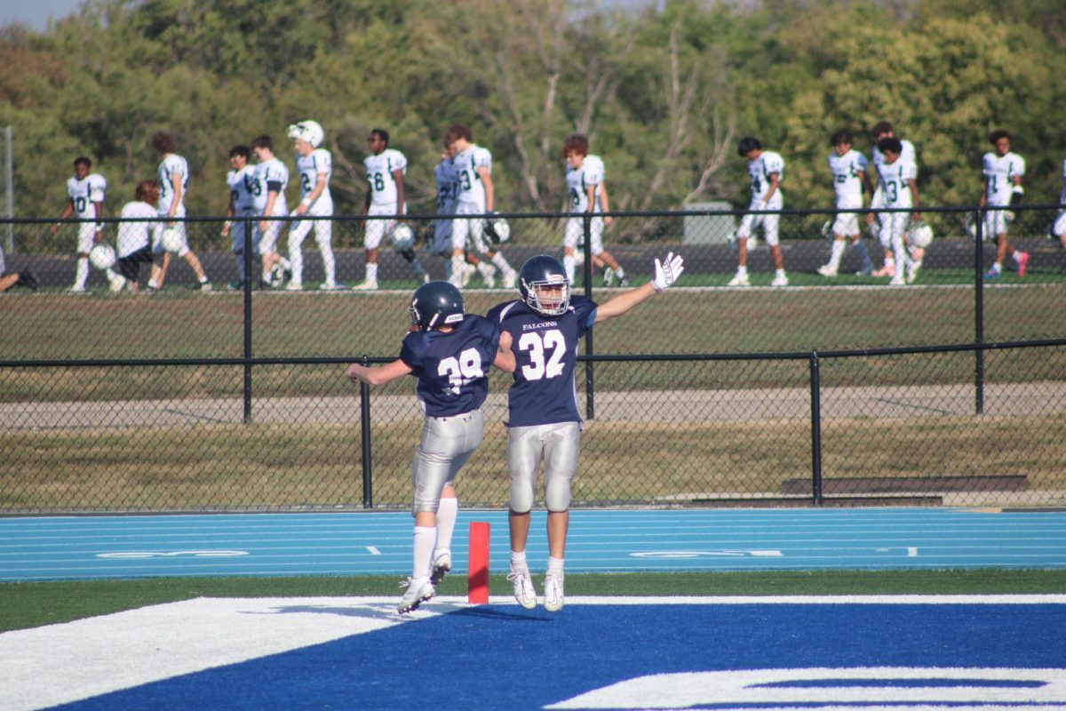 On September 19th, 2024, 7th grade football players Nolan Un and Jack Randall celebrate a touchdown by jumping in the endzone at the WRMS game against Lawrence Southwest.
