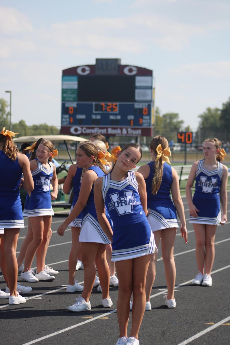 On September 19, 7th grade cheerleader Blake Classi poses for a photo on the track before performing a stunt to cheer on the 7th grade football team.
