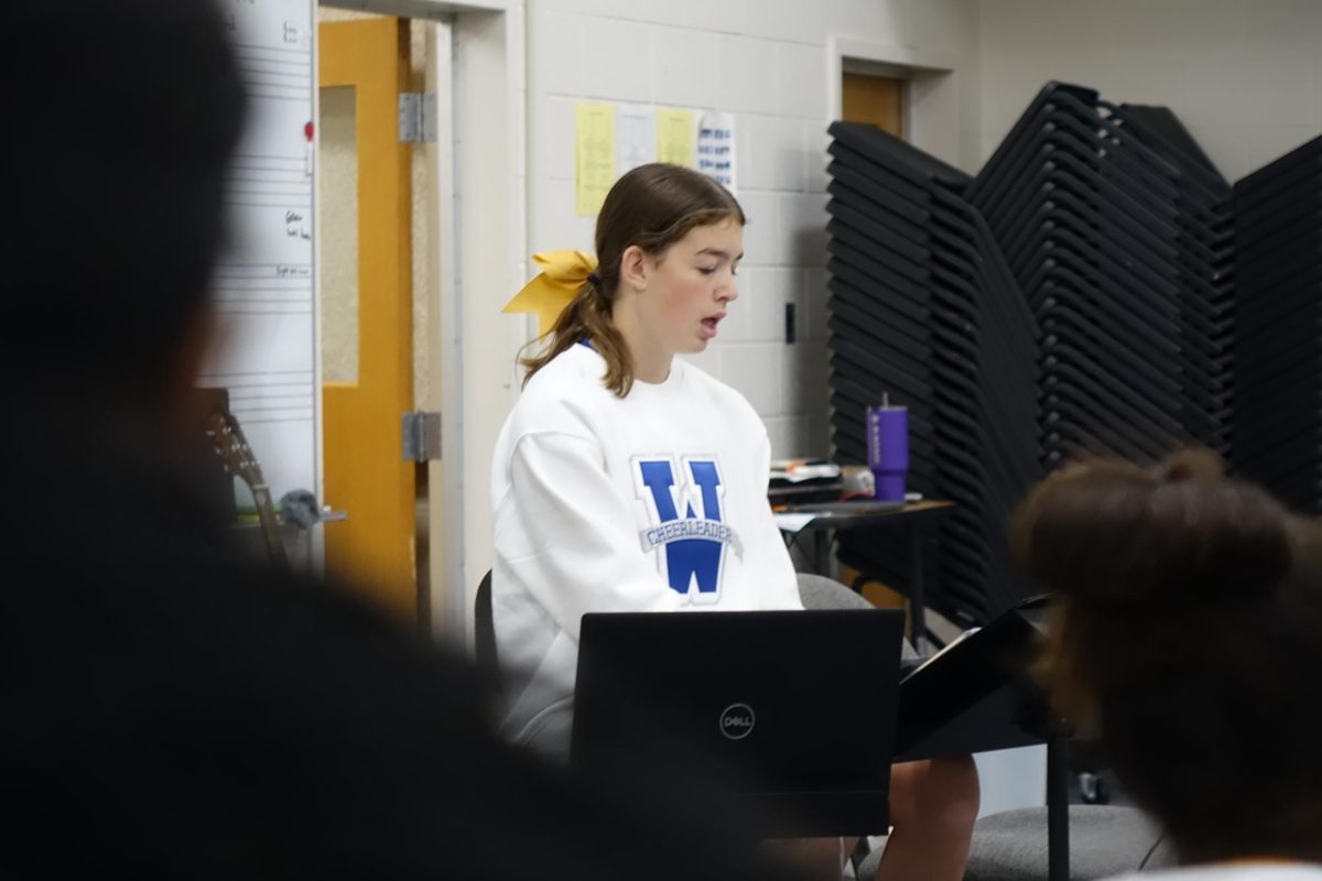 8th grader, Abby Calvert, instructs the girls in the choir room, during 3rd hour to help Mr. Lambotte. Calvert helped while Lambotte worked with the boys.
 
