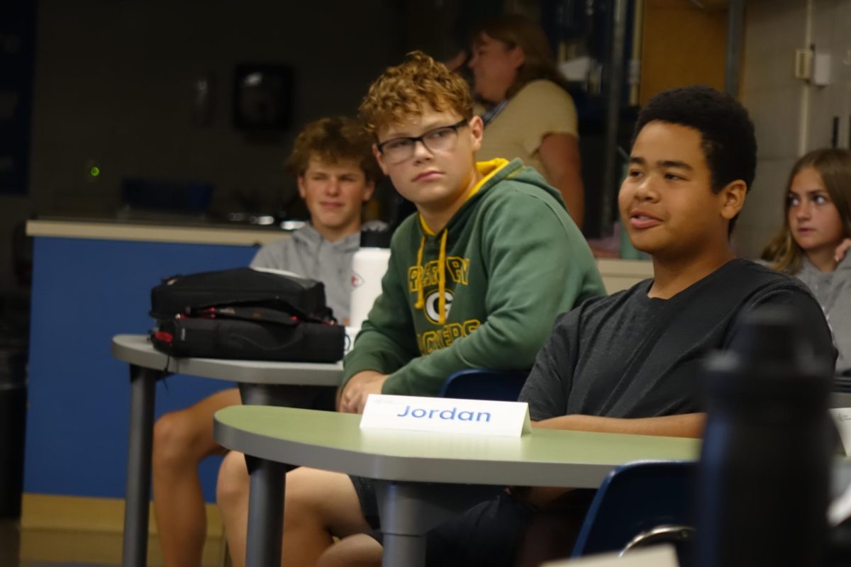 On Sept. 16, Jordan Webb, Noah Haverkamp, Jenica Passow, and Bo Loeffler  listen to the Junior Achievement speaker in FACS class to learn about different careers.