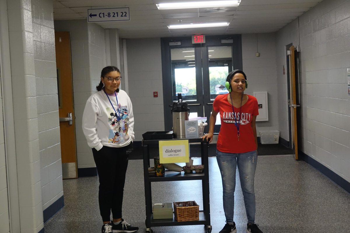 On Sept. 25 Jayla Nocktonick-Hymon and Gigi Ngari deliver coffee and treats to teachers and staff for their Dialogue Coffee orders in the 7th grade pod at WRMS 