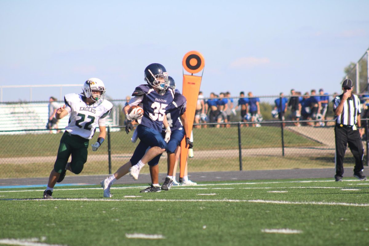 8th grader Ashton Crosswhite, runs with the ball to score a touchdown at the game on September 27th, 2024 against their opponent,  Eisenhower Middle School.
