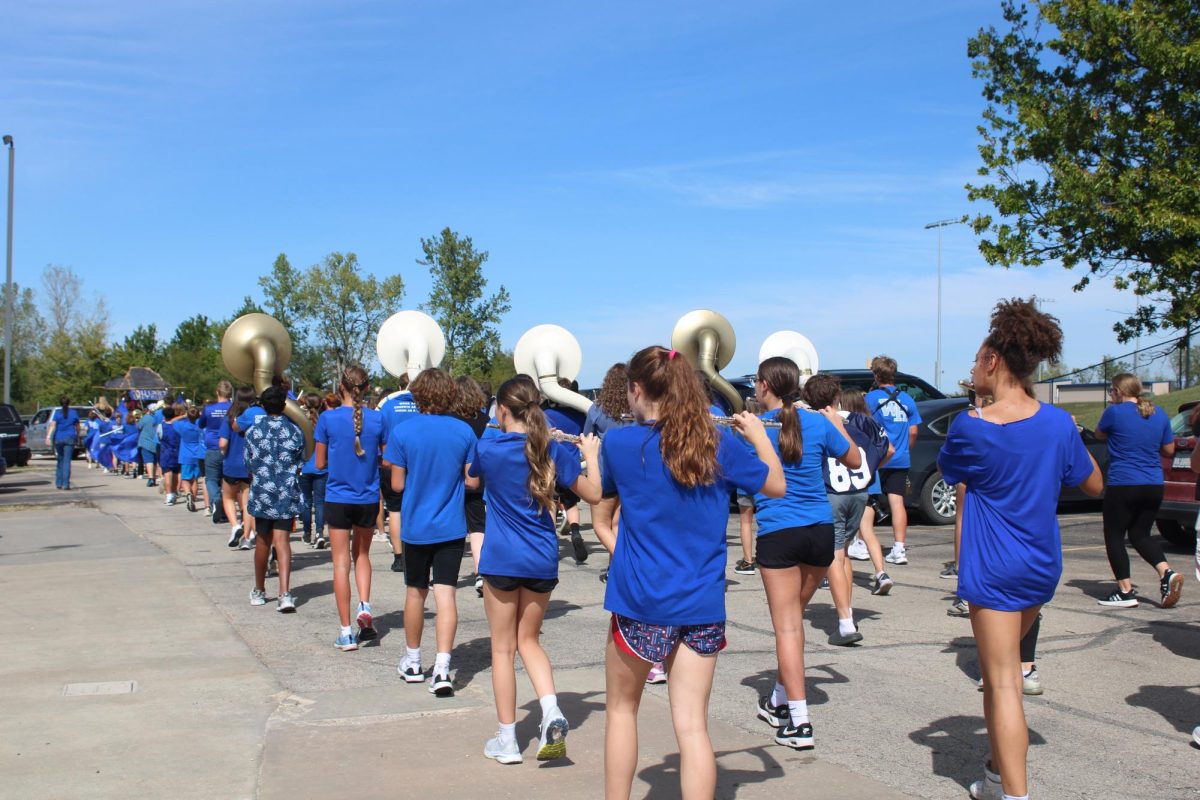 On Sept. 27 the eighth grade band marches down the parking lot at WRMS for the homecoming parade. 