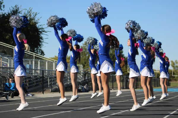 On Oct. 15, seventh grade cheerleaders hype up the crowd at the WRMS football game against Shawnee Heights by doing a cheer. Sophie Fawl (seventh) says, “I did cheer because some of my friends were trying out and it just sounded fun.” 